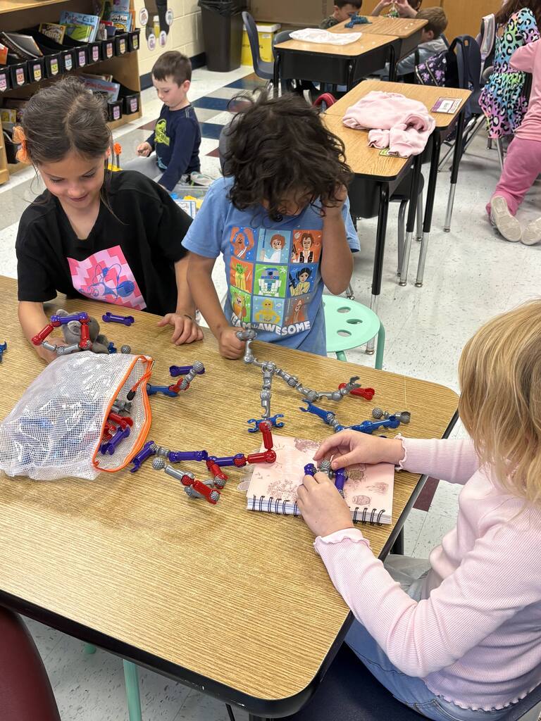 Girls play with connectors.