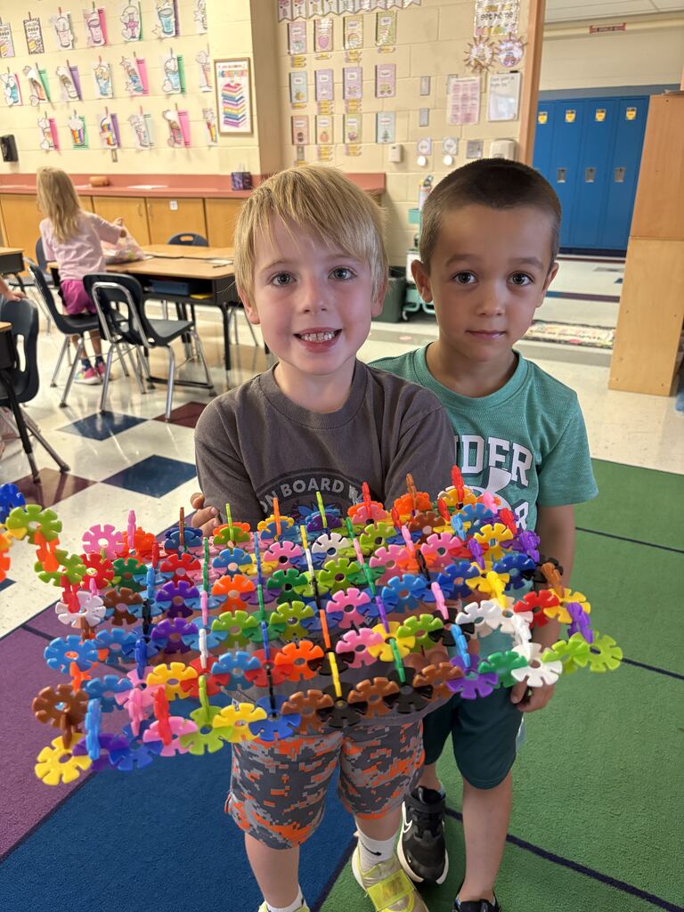 Boys showing off their creation.