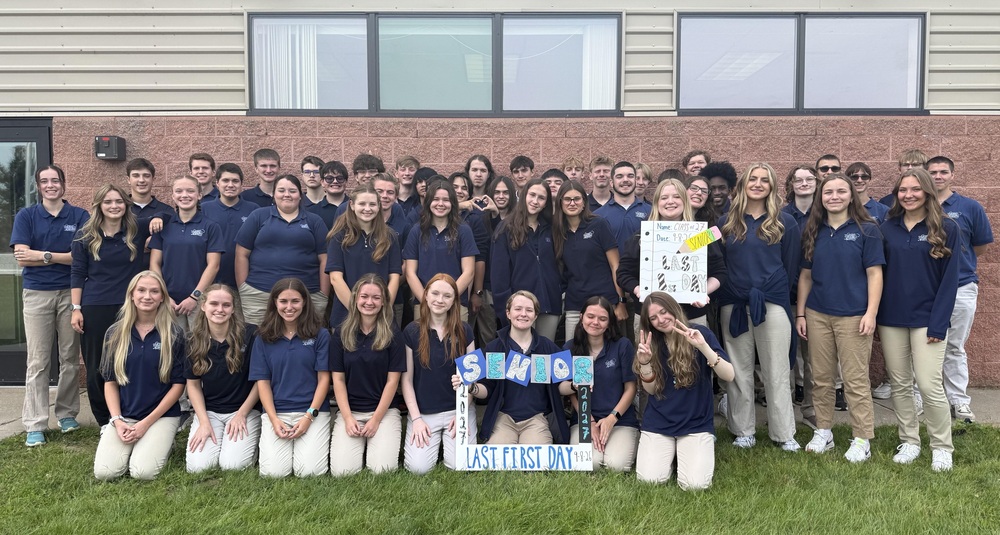group of students standing outside the school