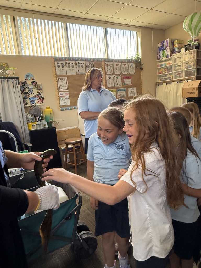 students holding live lamprey
