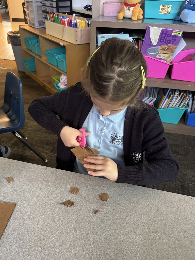 girl creating with a box