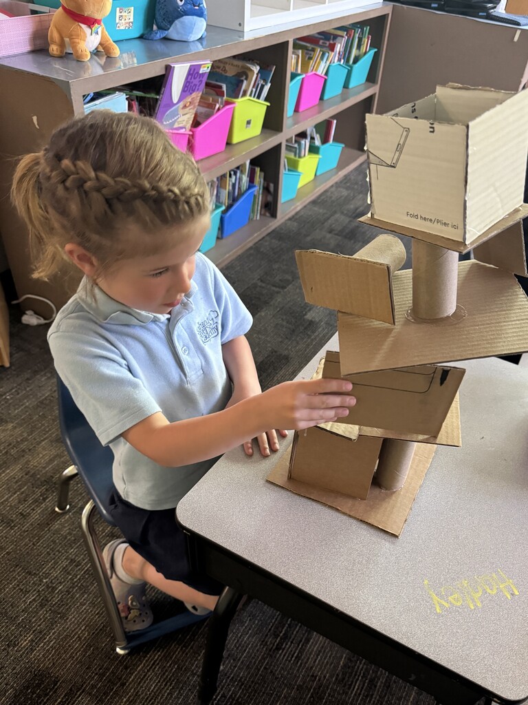 girl creating with a box