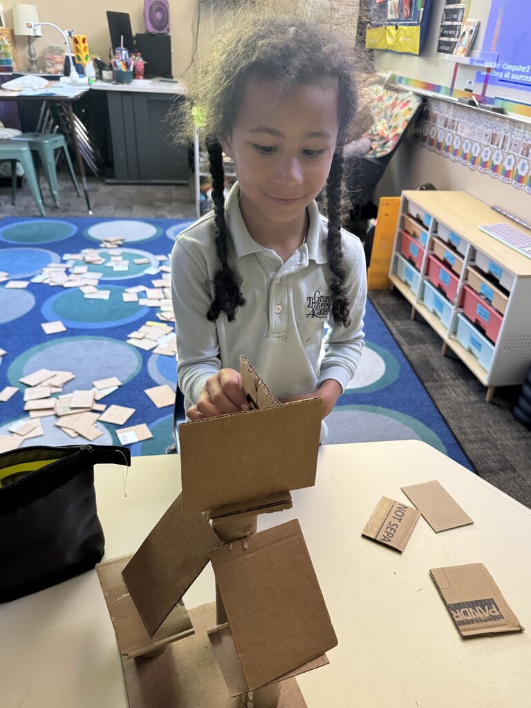 girl creating with a box