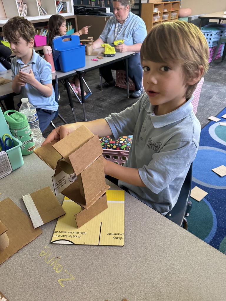 boy creating with a box