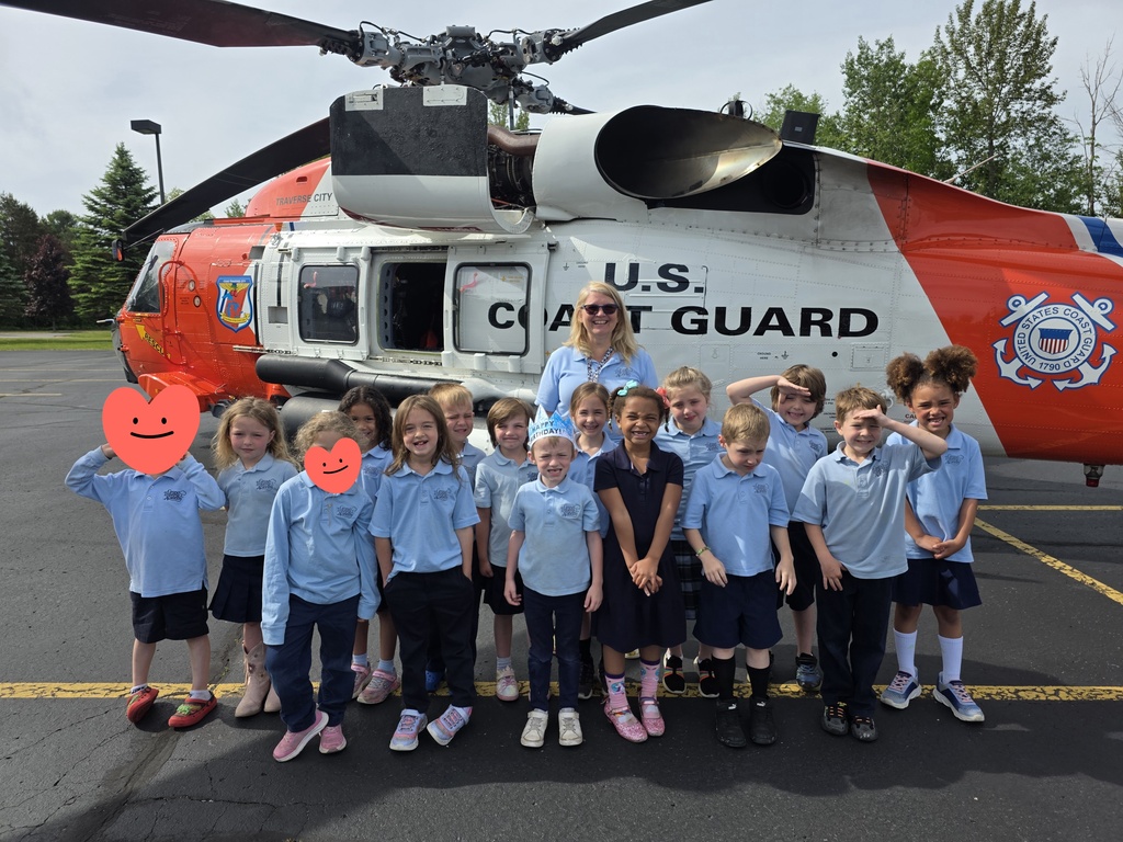 students and coast guard helicopter