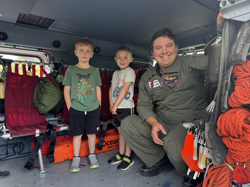 students and coast guard helicopter