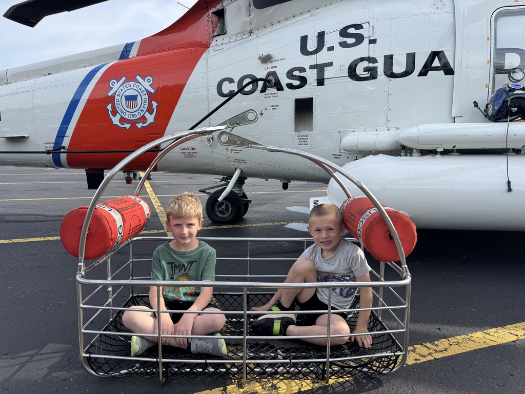 students and coast guard helicopter