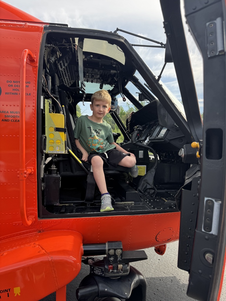 student and coast guard helicopter