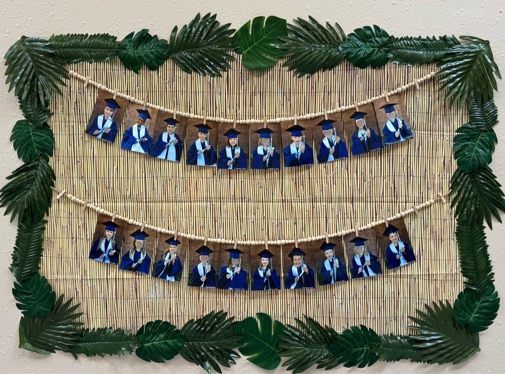 preschool students in graduation gowns