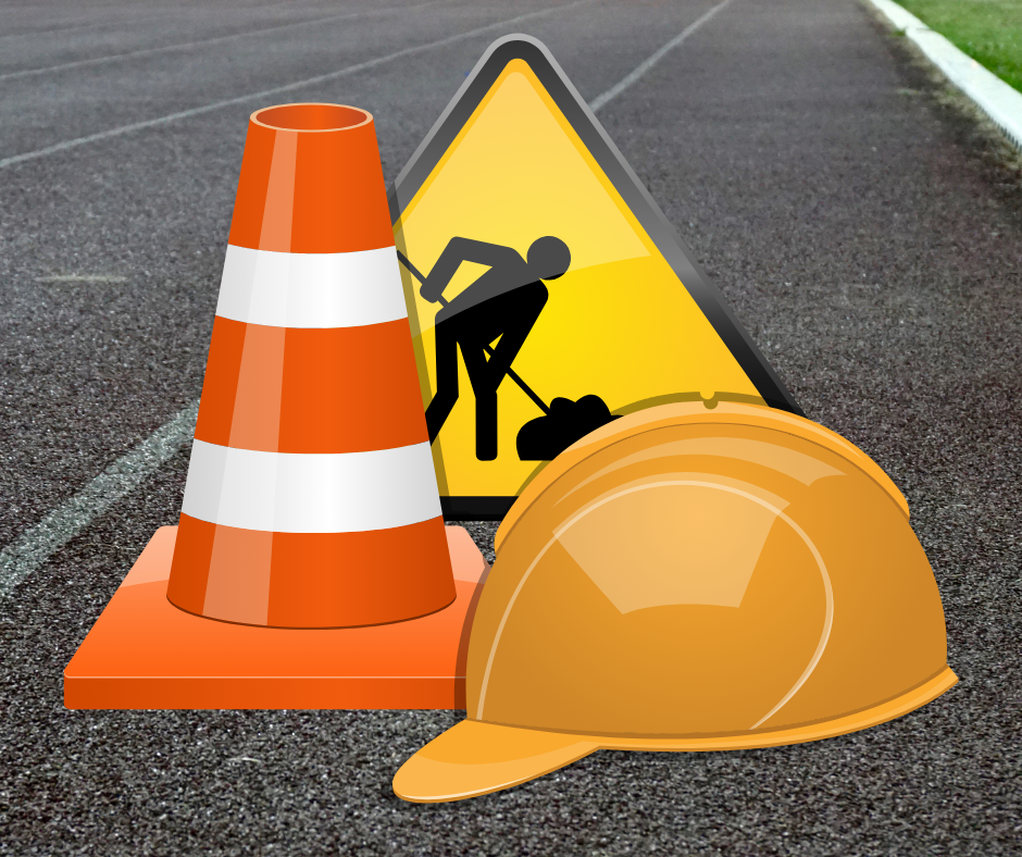 road with construction sign, cone and hat