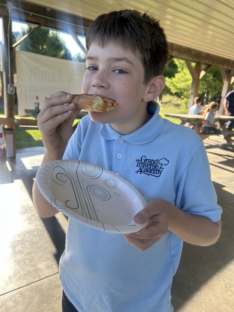 boy eating pizza