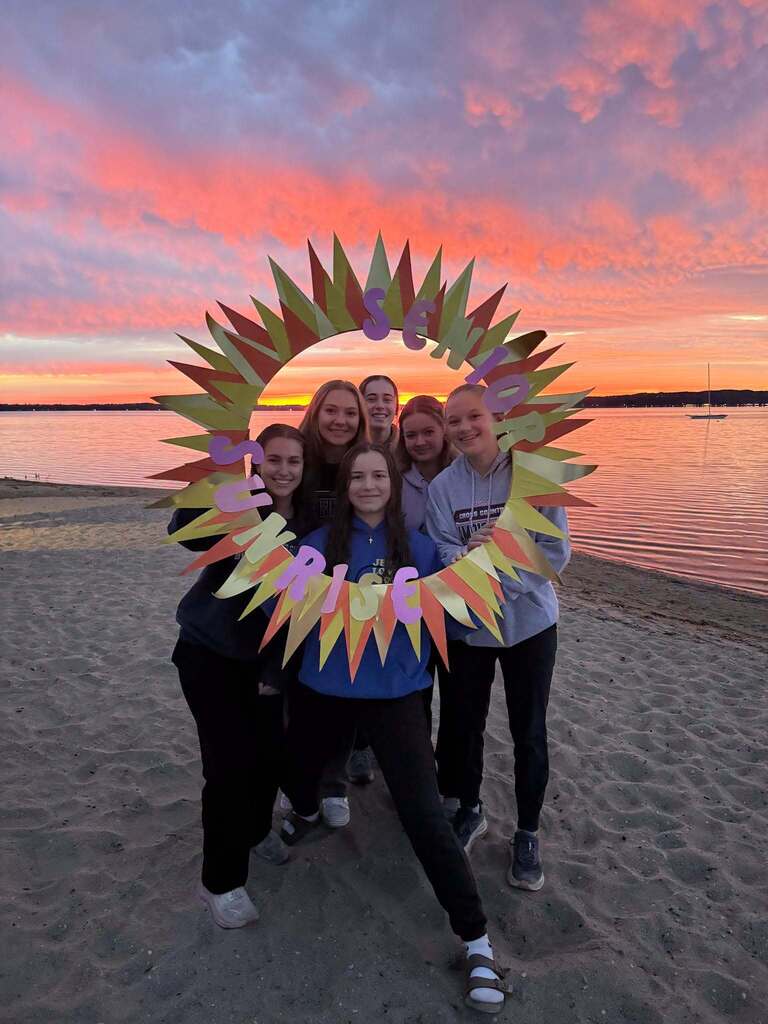 students watching the sun rise