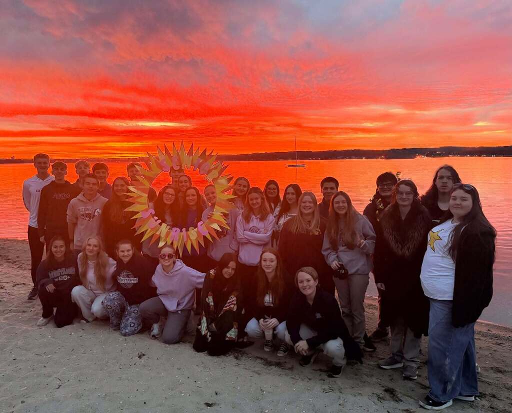 students watching the sun rise