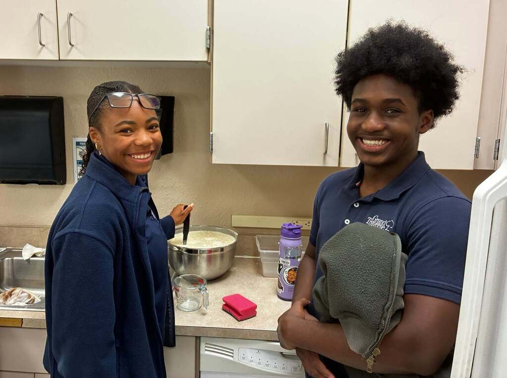 boy and girl mixing pancakes