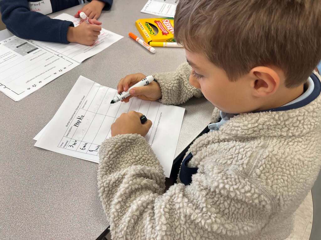 boy writing on a worksheet