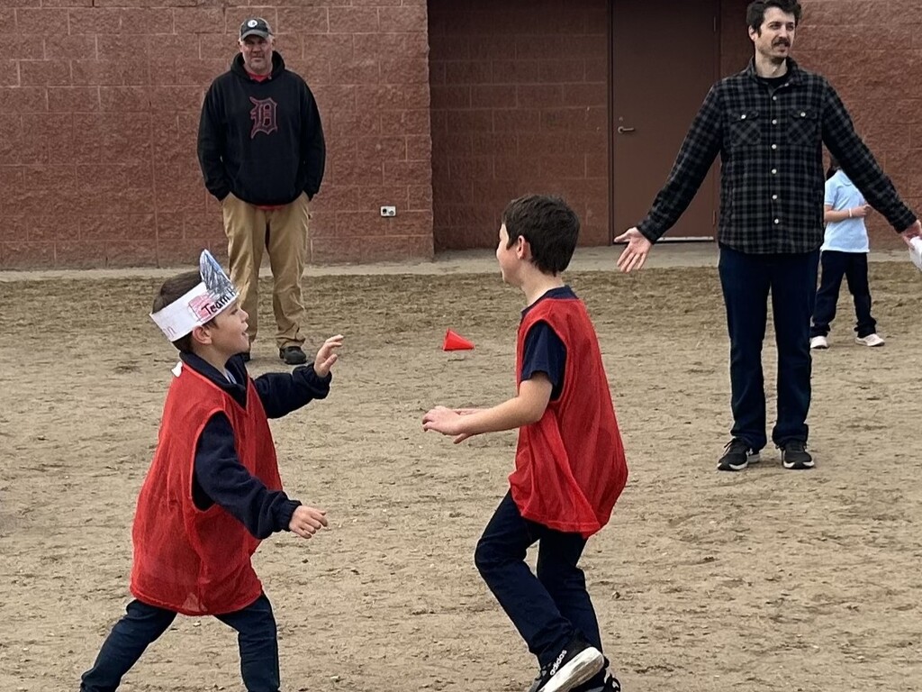 students and parents on playground