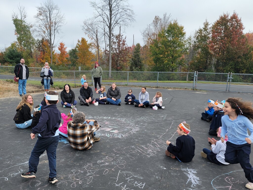 students and parents on playground