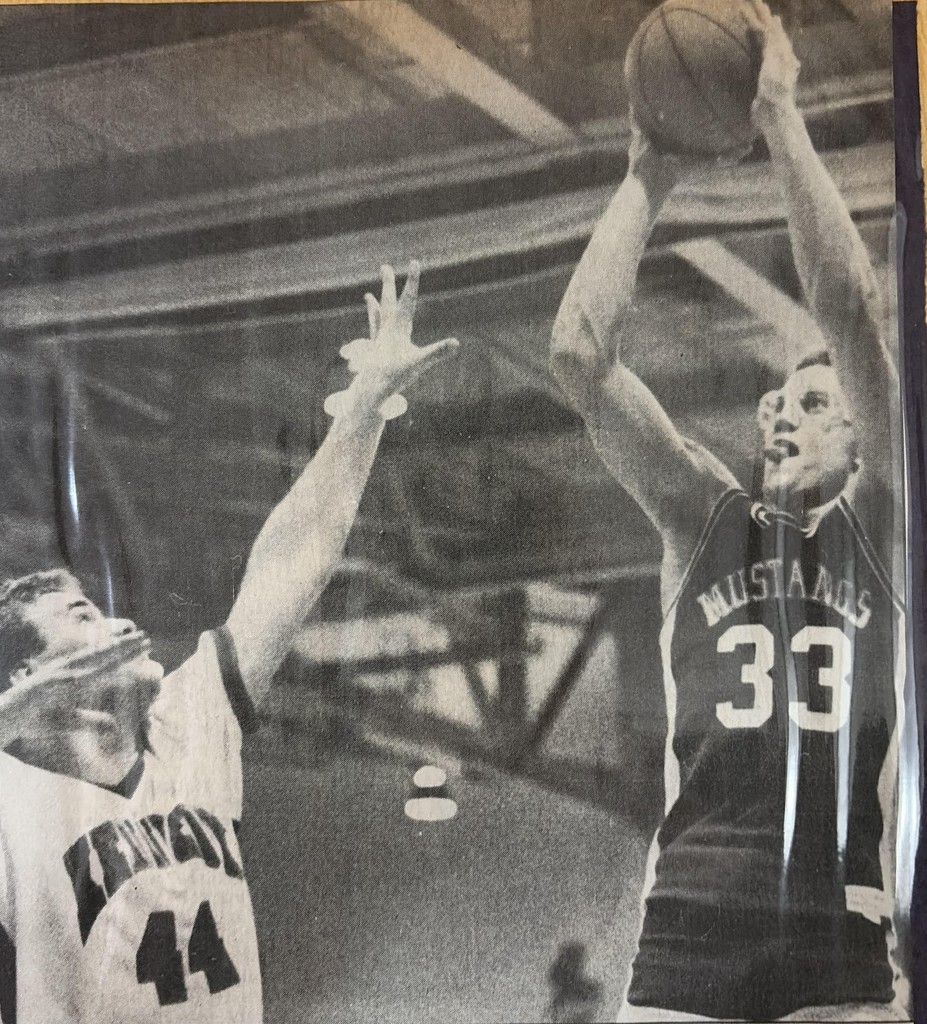  Grand Valley's 6-foot-7 senior Steve Oman shoots a jumper over Warren JFK's Tim Ryan - who went on to be a U.S. representative and ran for president - in the 1988-89 Division III district championship game (Star Beacon file photo)