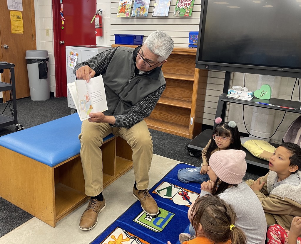 Dr. Ben reading to students