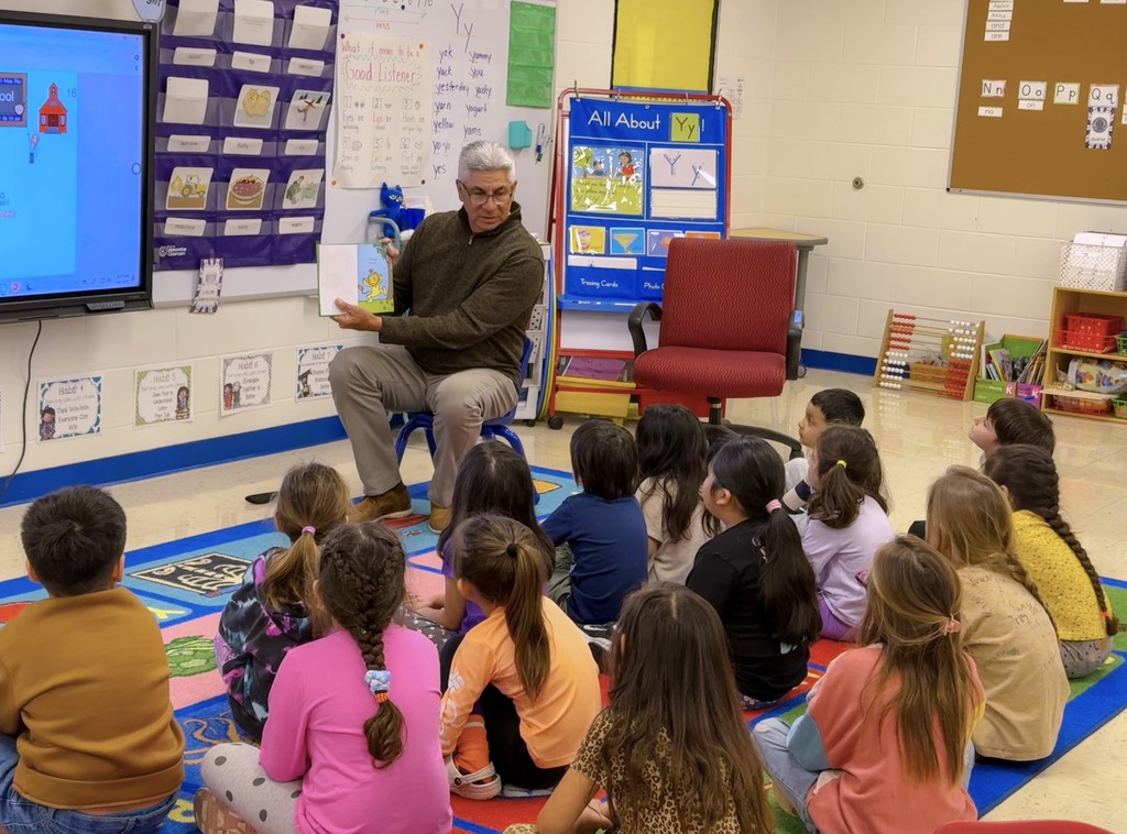Dr. Ben reading to students