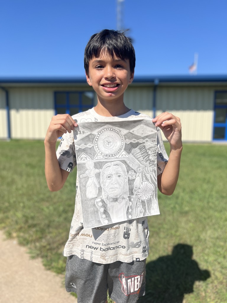 Isaiah Ruiz holding his artwork