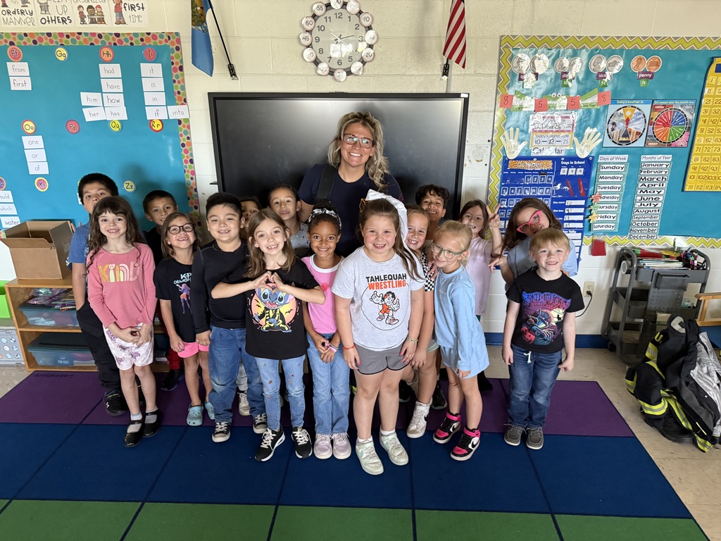 Students pose with Firefighter