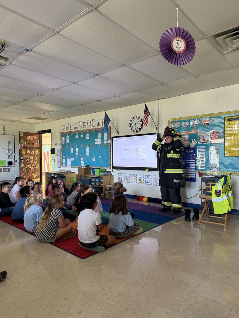 Students pose with Firefighter