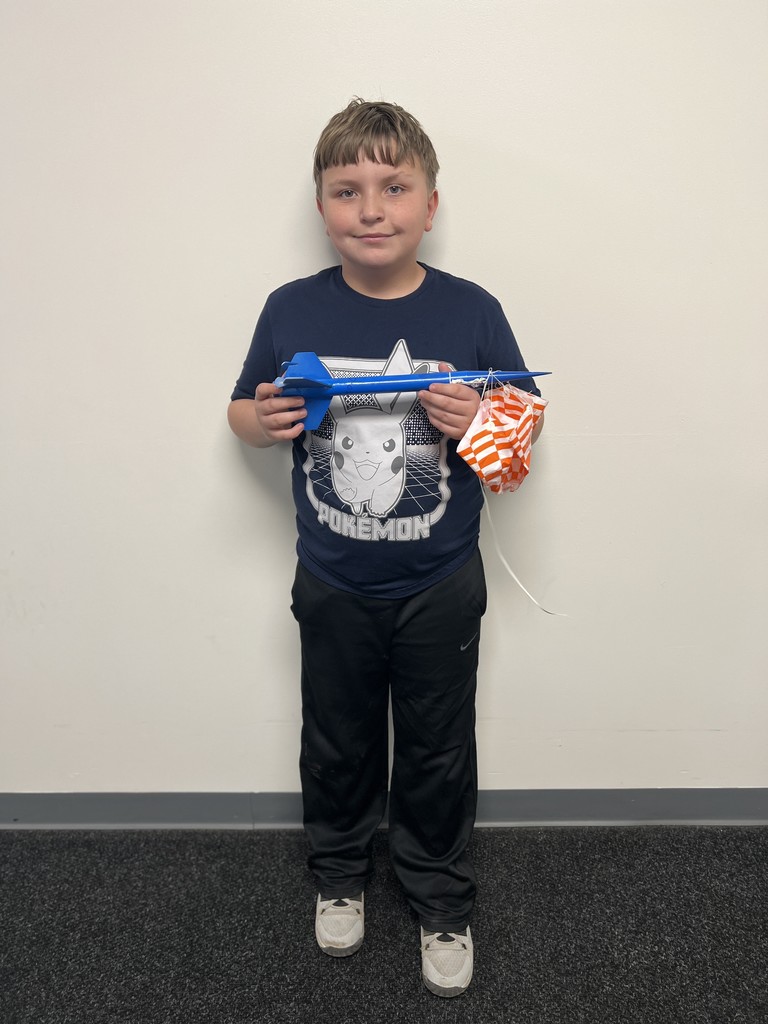 Students pose with rockets