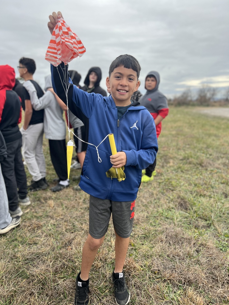 Students pose with rockets