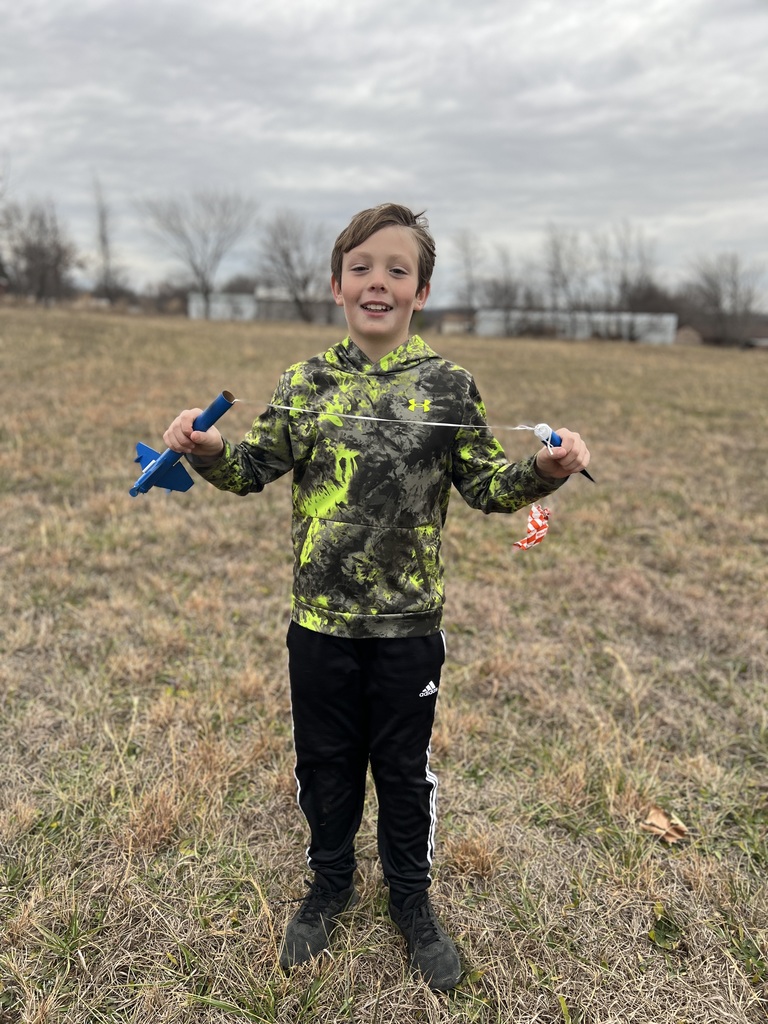 Students pose with rockets