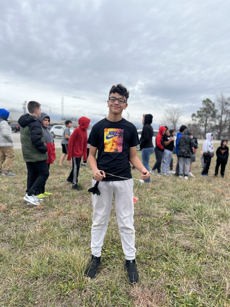 Students pose with rockets