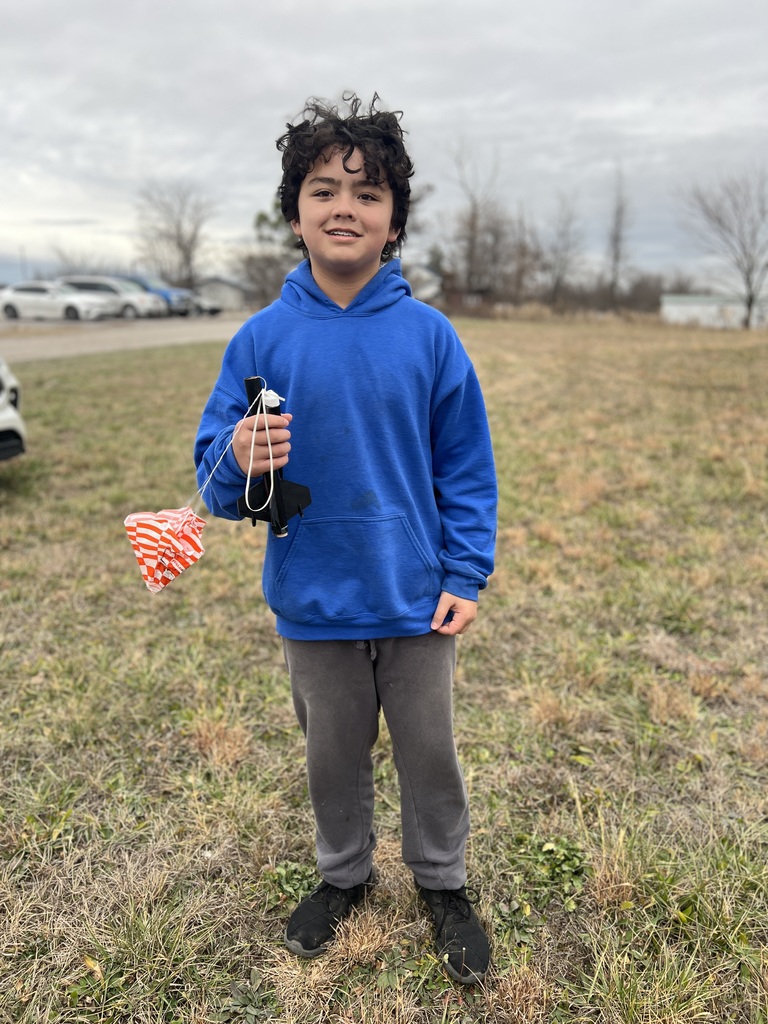 Students pose with rockets