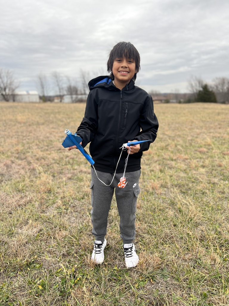 Students pose with rockets