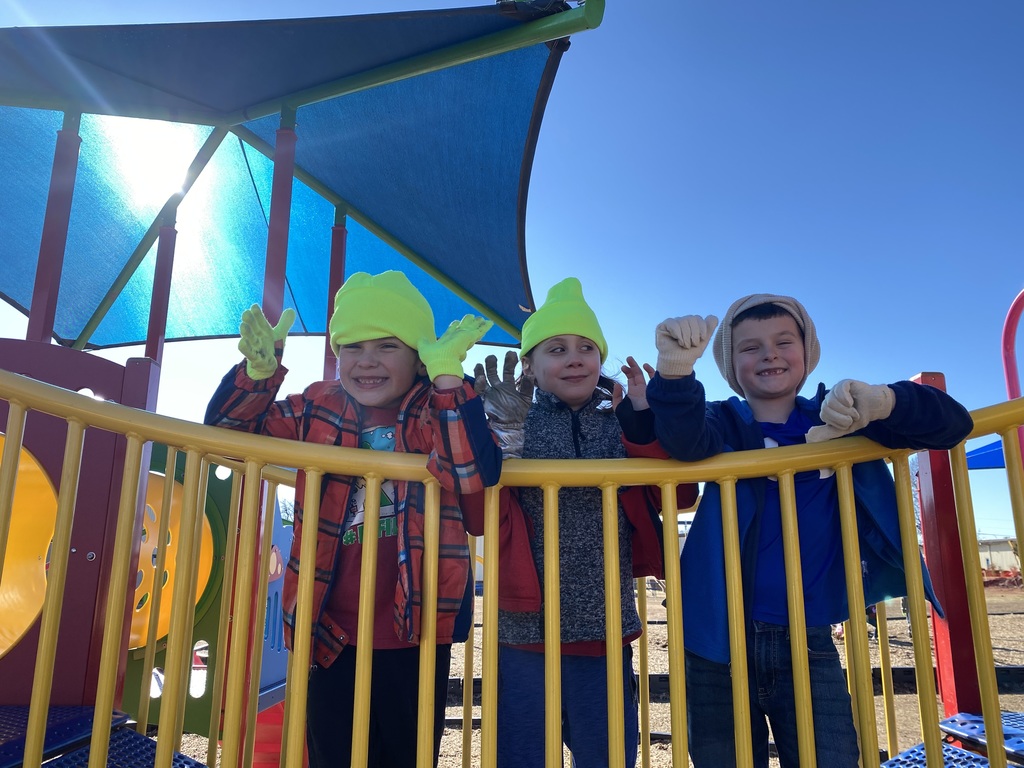 Students show off their hats and gloves