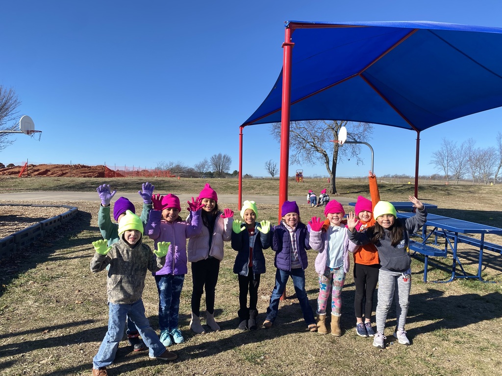 Students show off their hats and gloves