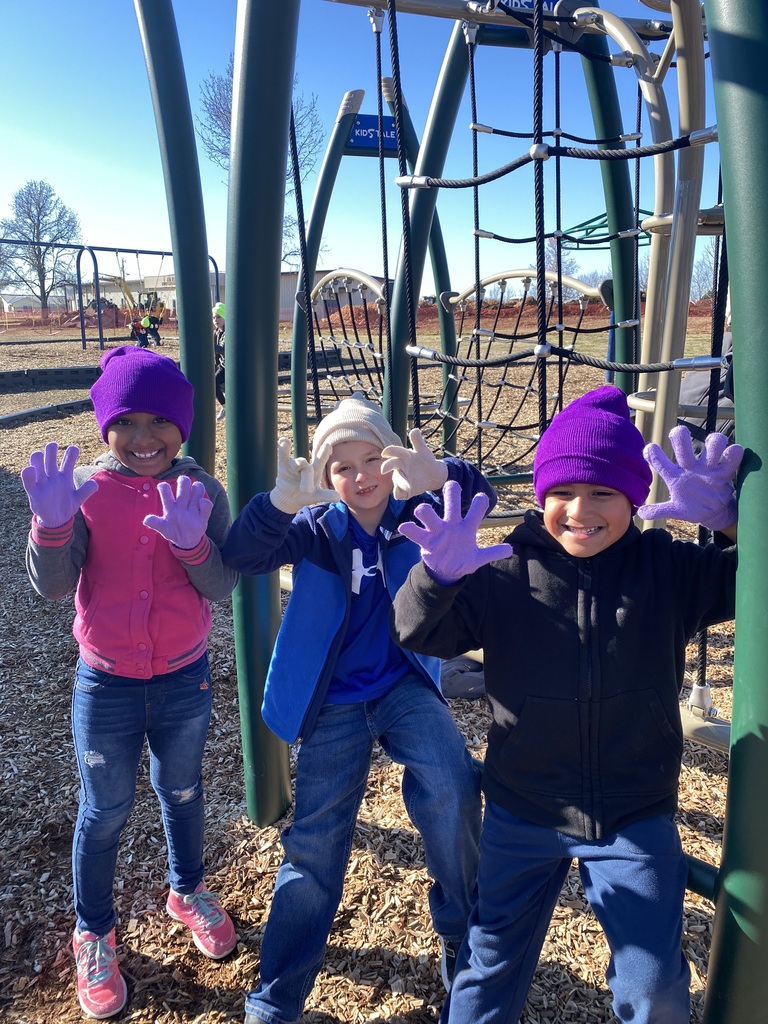 Students show off their hats and gloves