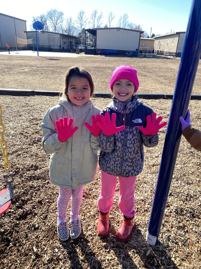 Students show off their hats and gloves