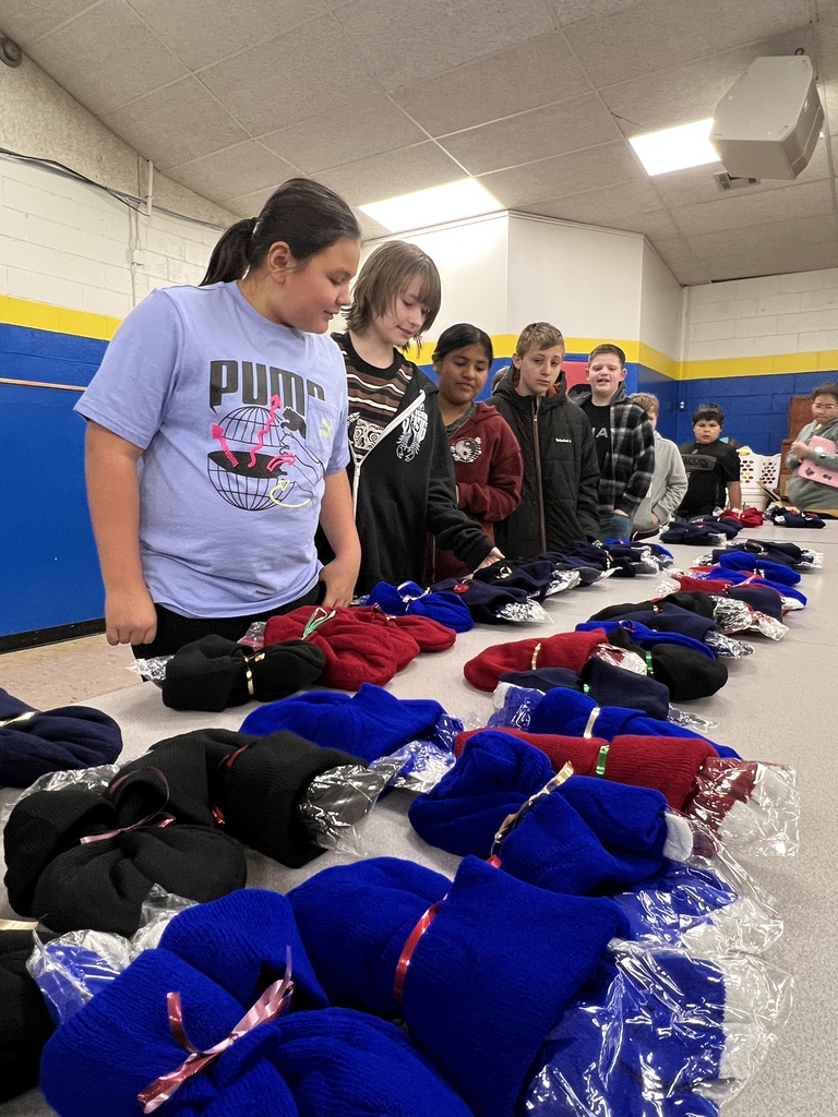 Students show off their hats and gloves