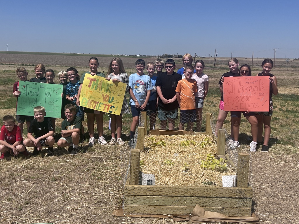 Students behind one of their garden beds