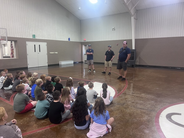 Fire fighters with students 