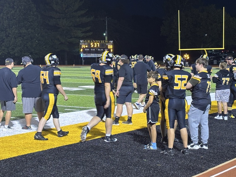kickoff team huddling after a score 