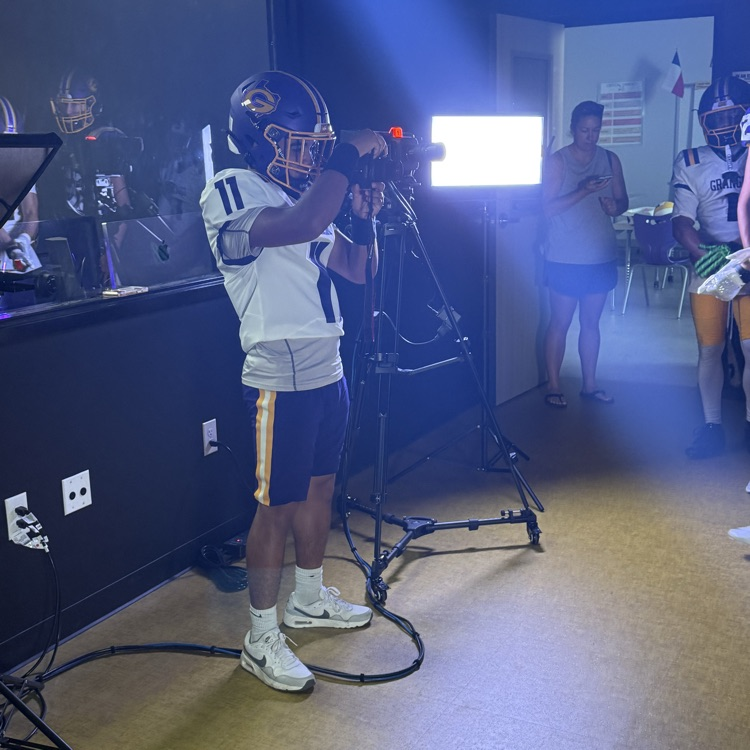 Chris Luna taking pictures at media day