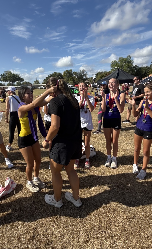 JH girls giving Coach Shelby a Medal 