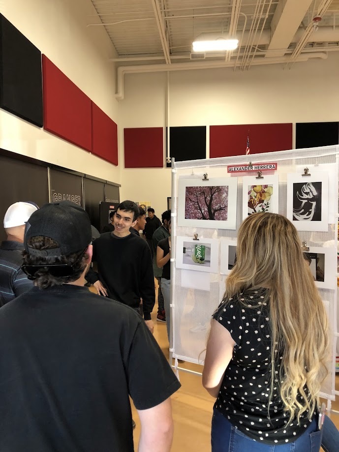 Alexander Herrera displaying his artwork
