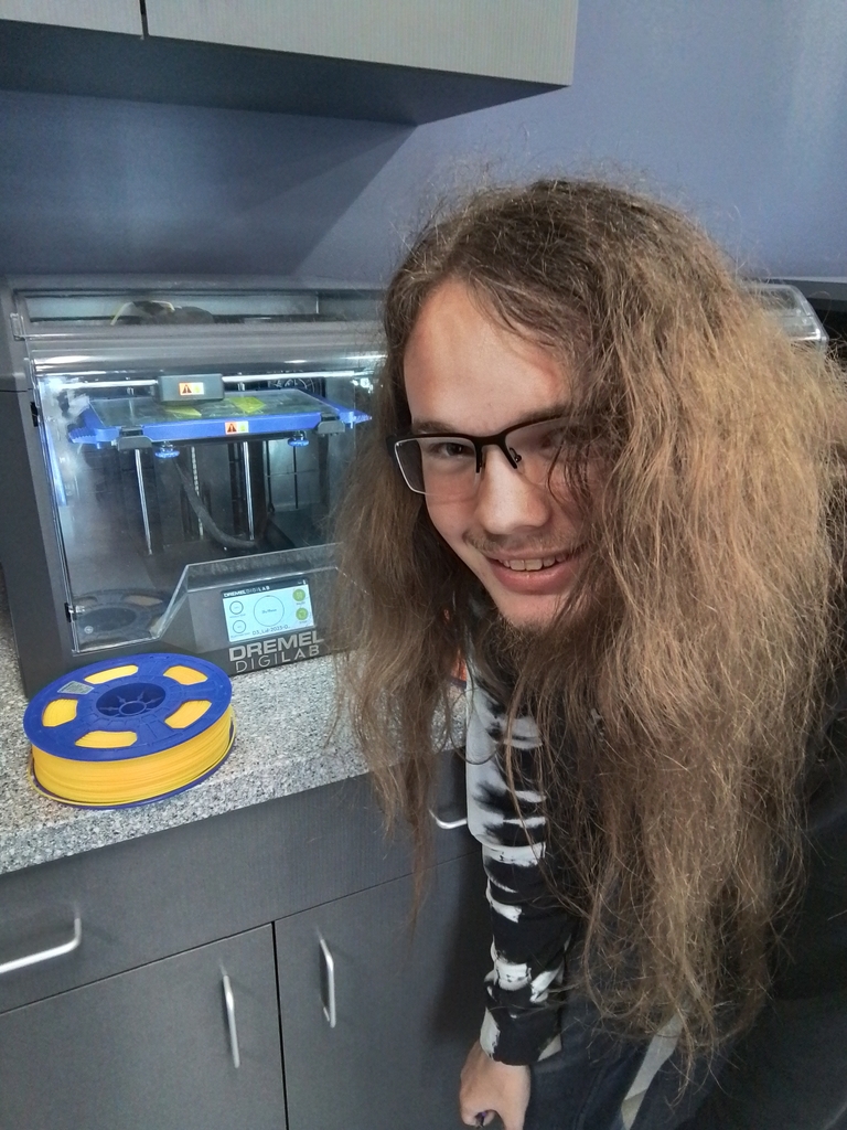 Isaiah working on the printer