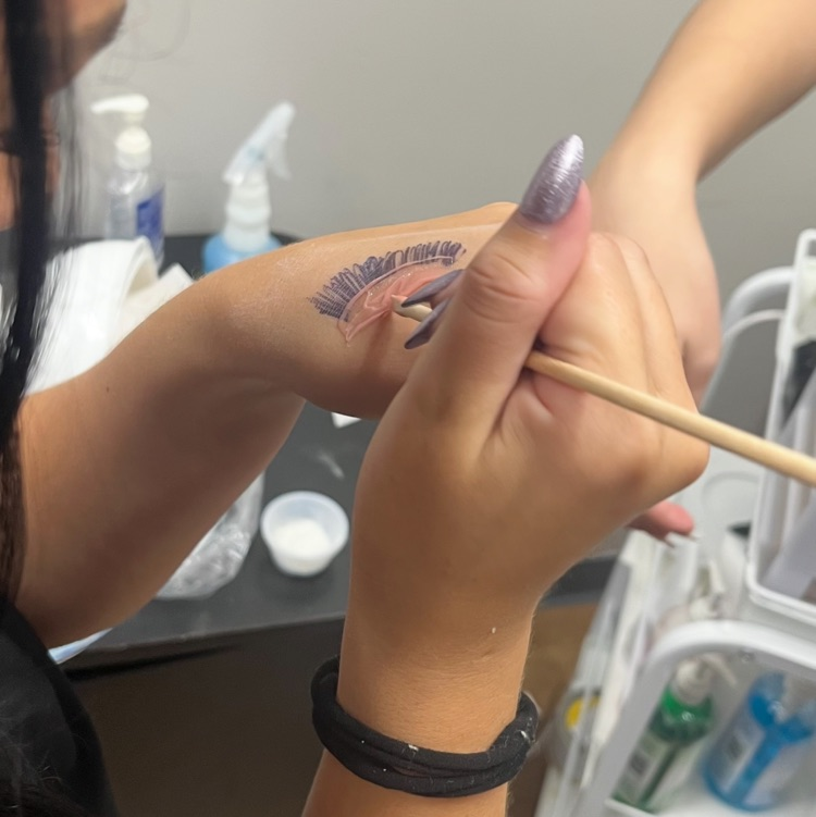 Cosmetology students practicing waxing!