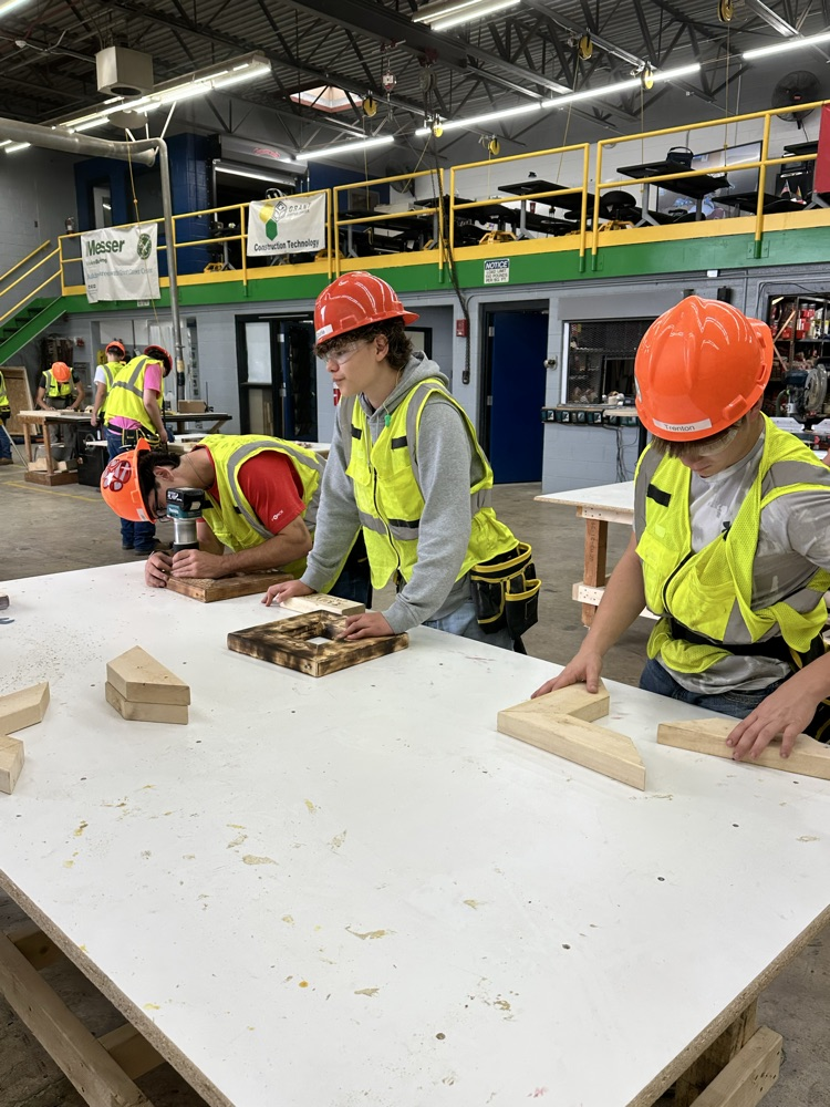 Students are using various tools to create their own frames