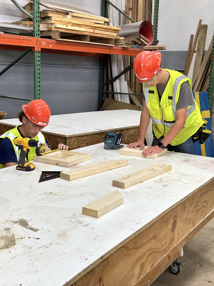 Students are using various tools to create their frames