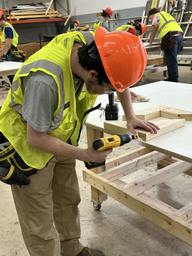 students are using various tools to design their own frames