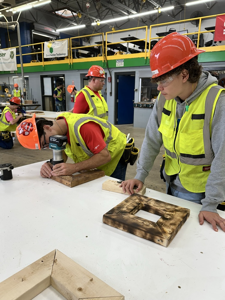 Students are using various tools to design their own frames.